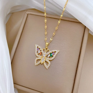 Luxury gold butterfly necklace with colorful zircon micro-inlays on beige jewelry box