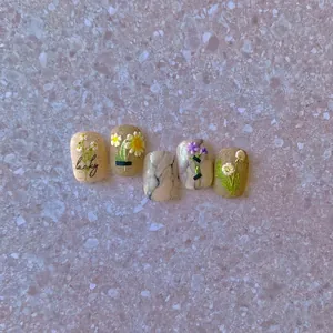 3D embossed nail stickers featuring sunflowers, marble textures and Lucky lettering art