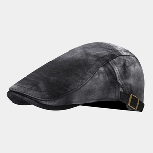 Detail of vintage gray tie-dye beret with adjustable antique copper side metal buckle