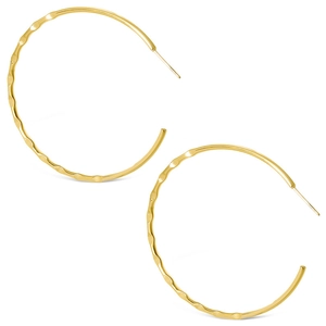 Macro view of golden stainless steel hoop earrings with wavy textured finish