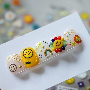 3D embossed nail stickers featuring yellow smileys and daisies in vibrant 5-piece set