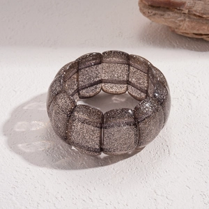 Detailansicht eines Vintage Acryl-Armbands mit braunem Glitzer und quadratischen Gliedern