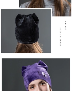 Detail of purple velvet cat ear beanie featuring a rhinestone bow and soft knit texture