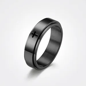 Men's black rotatable spinner ring with cross engraving and brushed metal finish