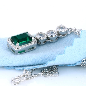 S925 sterling silver emerald cut green stone pendant necklace with brilliant halo accent