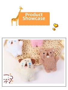 Close-up of cute plush puppy and cat keychains with embroidery and gold metal clips