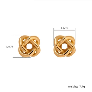Detail view of 1.4cm gold-plated twist stud earrings with weight of 7.7g shown on white background