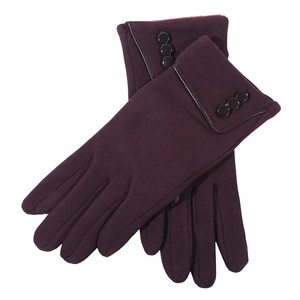 Close-up of deep purple knit gloves with folded cuffs and decorative button details