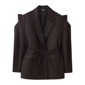 Detail view of M size label and structured shoulder pads on deep brown blazer jacket
