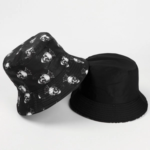 Detail of reversible bucket hat showing skull crown print and solid black side