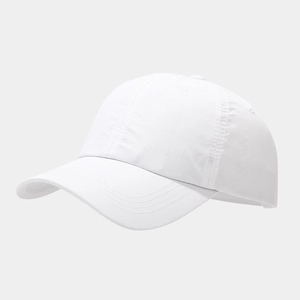Detail view of a white breathable baseball cap showing the six-panel structure and curved brim