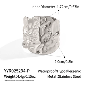 Detailed view of silver stainless steel ring with a 2cm wide geometric pleated texture