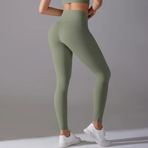 Close-up of olive green high-waist yoga pants highlighting tummy control and booty lift fit