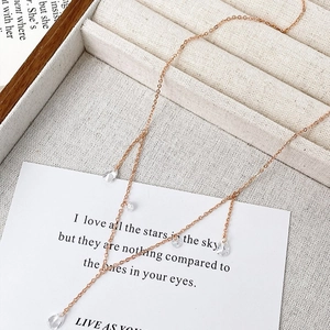 Rose gold necklace with sparkling zircon water drop tassels on a romantic verse card