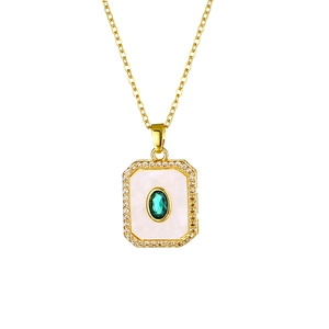Detail of 18K gold plated necklace with white mother of pearl and green center gemstone
