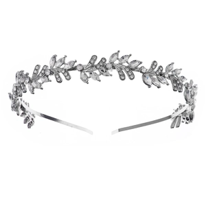 Close-up of sparkling rhinestone leaf design on silver alloy headband for weddings