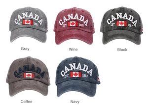 Flat lay of vintage washed cotton baseball caps with CANADA embroidery in five colors