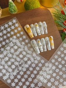 Detailed view of 3D embossed snowflake nail stickers for Christmas manicure art decoration