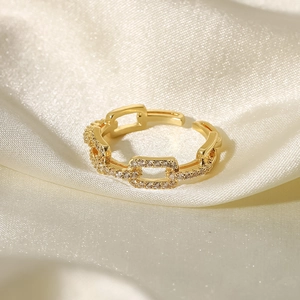 Detail view of 18K gold plated chain link ring with sparkling cubic zirconia inlay