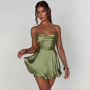 Detail of elegant olive green satin slip dress featuring cowl neck and smooth silk texture