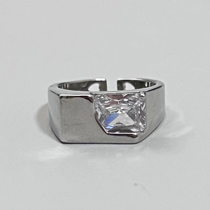 Detail of silver adjustable ring featuring a rectangle cut zircon and geometric band