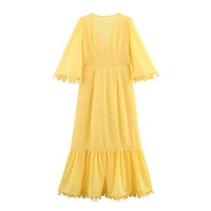 Elegant yellow V-neck maxi dress with lace trim and flare sleeves on white background