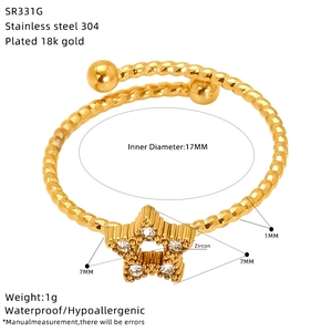 Detail view of a 18K gold plated stainless steel ring with zircon star and 17MM diameter