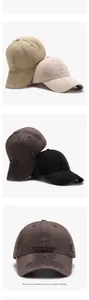 Detail of vintage washed cotton baseball cap featuring urban embroidery and side label