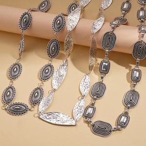 Vintage silver metal waist chain set featuring oval embossed and hammered leaf designs