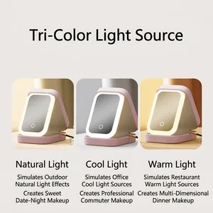Portable pink LED makeup mirror with three light modes and foldable stand for vanity use