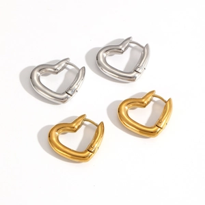 Polished stainless steel heart-shaped hoop earrings in gold and silver finishes