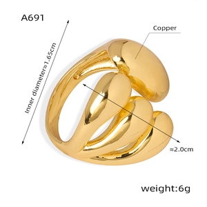 Detail view of golden wide ring with layered streamline design and 2.0cm width dimensions