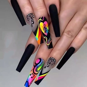 Detail of long coffin press-on nails with matte black finish and neon music heart patterns