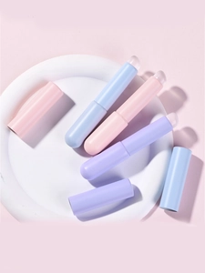 Macro detail of portable silicone lip brushes with soft matte lids in pastel colors