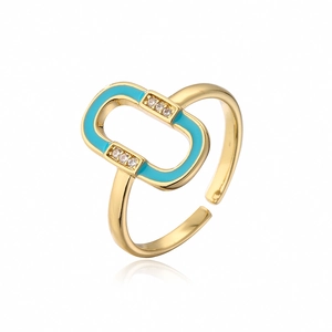 Macro detail of 18K gold plated ring with blue enamel and sparkling zircon stones