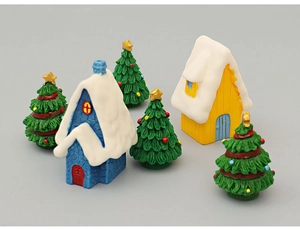 Miniature Christmas set with two snow-capped houses and four decorated pine trees