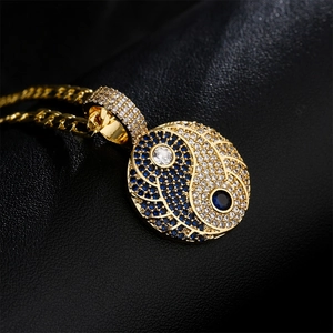 Gold-plated Tai Chi Yin Yang pendant necklace with blue cubic zirconia on Cuban chain
