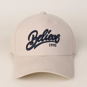 Detail of 1970 Believe 3D embroidery on beige cotton baseball cap with curved brim