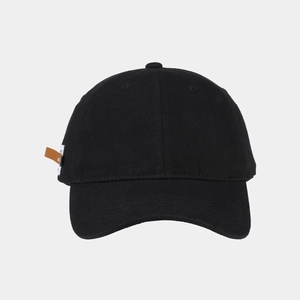 Detail of black cotton canvas baseball cap showing 6-panel texture and side leather tag