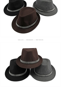 Close-up of three vintage wool fedora hats with silver rivet buckle belts in black, brown and grey
