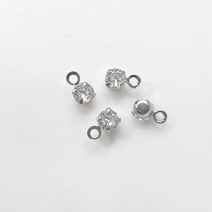 Detailed close-up of gold-plated cubic zirconia charms for DIY jewelry making accessories