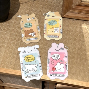 Detail of four cute cartoon photocard holders in bear, dog, and rabbit styles with bead chains