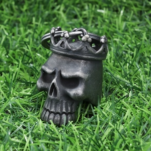 Macro shot of antique silver crown skull pendant made of durable 316 stainless steel