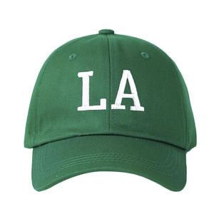 Green cotton baseball cap with white LA embroidery in a minimalist vintage style