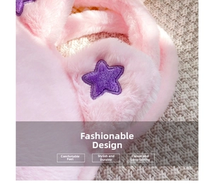 Close-up of pink plush material featuring a purple star embroidery and soft faux fur texture