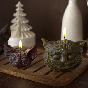 Artistic Sphinx and Cheshire cat resin molds candles with detailed facial textures