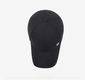 Top down view of black twill baseball cap with six panel design and square side logo
