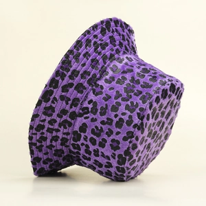 Close-up of plush purple leopard print bucket hat showing soft faux fur texture and stitching