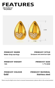 Détail macro de boucles d'oreilles goutte d'or avec incrustation de zircon coeur