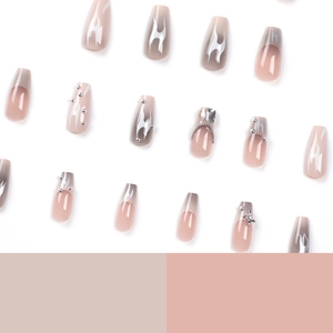 Coffin press-on nails featuring grey flame patterns, silver stars, and crystal rhinestones
